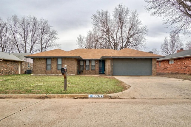 ranch-style house with a garage, concrete driveway, brick siding, and a front lawn