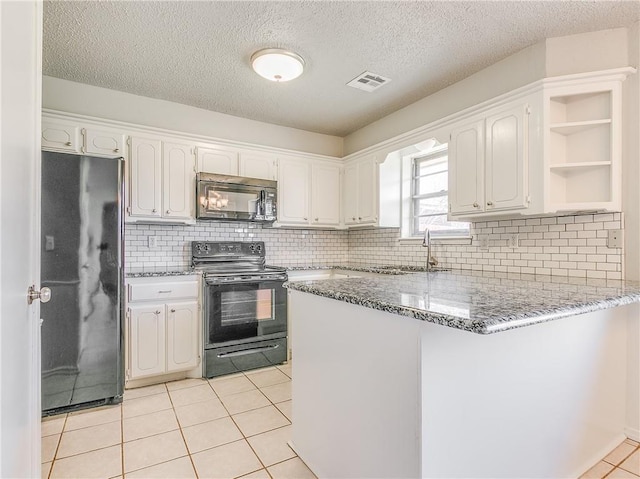 kitchen featuring visible vents, white cabinets, a peninsula, black appliances, and open shelves