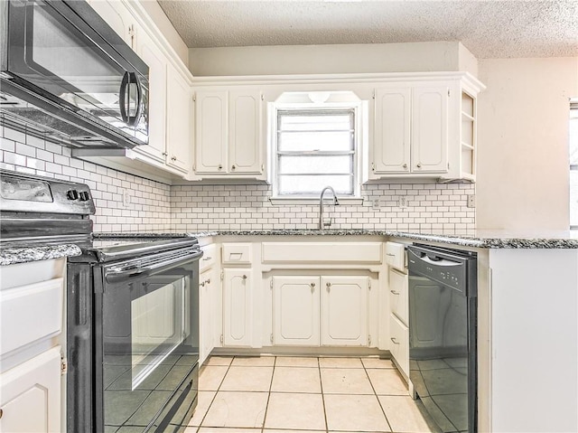 kitchen featuring decorative backsplash, black appliances, open shelves, a sink, and light tile patterned flooring