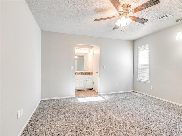 unfurnished bedroom with light colored carpet, visible vents, and baseboards