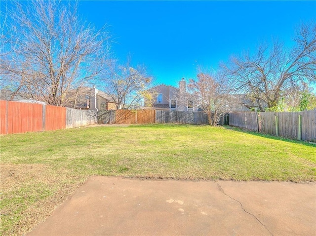 view of yard featuring a fenced backyard