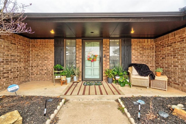 property entrance with brick siding