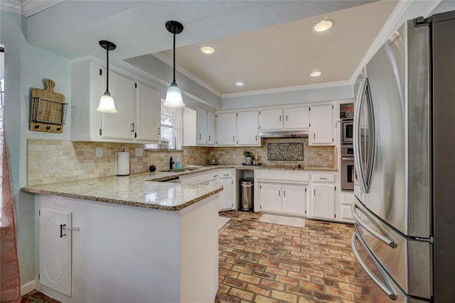 kitchen featuring under cabinet range hood, a peninsula, appliances with stainless steel finishes, crown molding, and brick floor