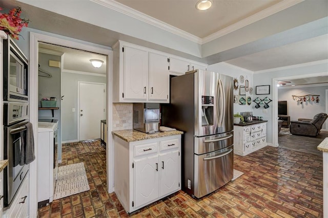 kitchen featuring decorative backsplash, white cabinetry, stainless steel appliances, and crown molding