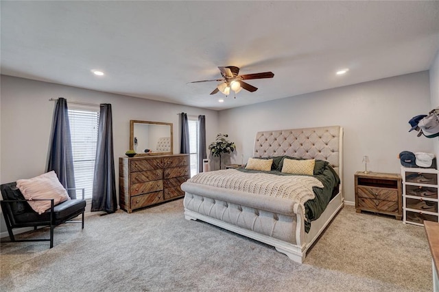 carpeted bedroom featuring recessed lighting, multiple windows, and ceiling fan