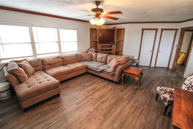 living room with ceiling fan, a textured ceiling, dark wood finished floors, and crown molding