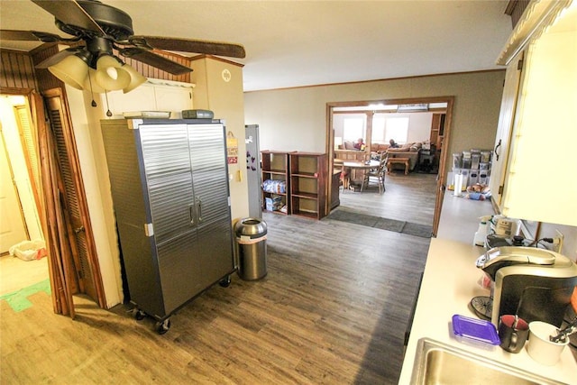 kitchen featuring a ceiling fan and wood finished floors