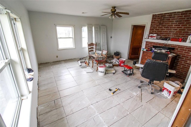 living area featuring a ceiling fan