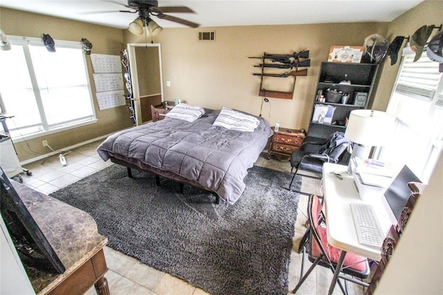 tiled bedroom featuring visible vents