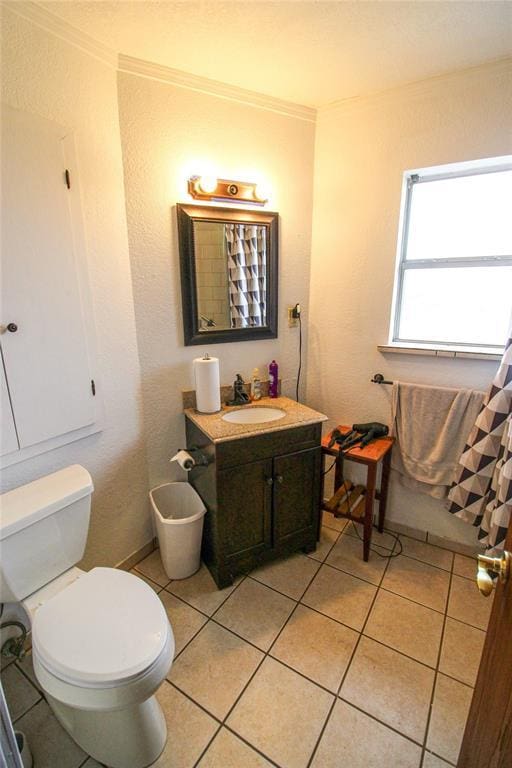 full bathroom featuring vanity, toilet, tile patterned flooring, and ornamental molding