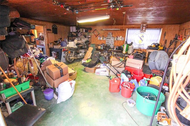 interior space with a workshop area and wood walls