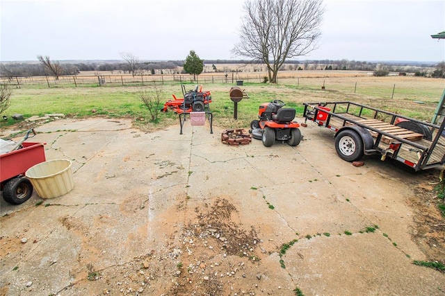 exterior space with a rural view and fence