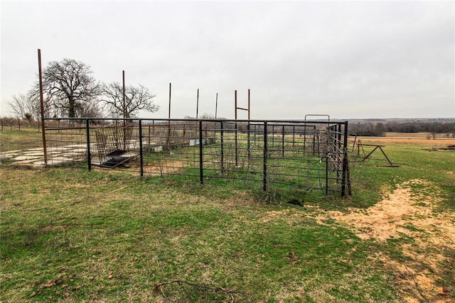 view of yard with a rural view