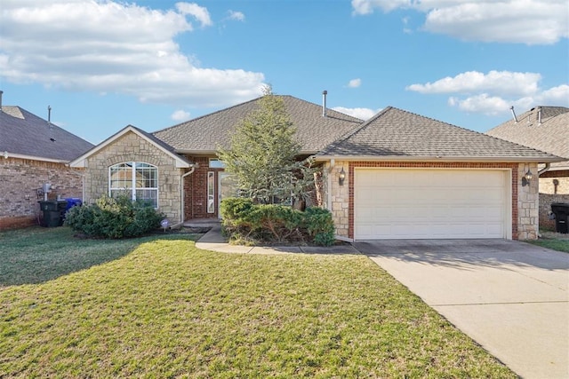 view of front of home with driveway, a shingled roof, a front lawn, stone siding, and a garage