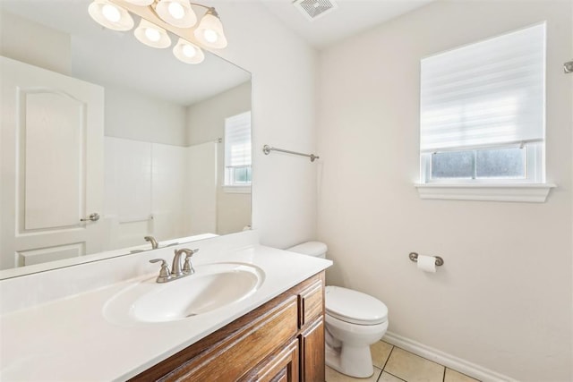 bathroom featuring vanity, visible vents, a shower, tile patterned floors, and toilet