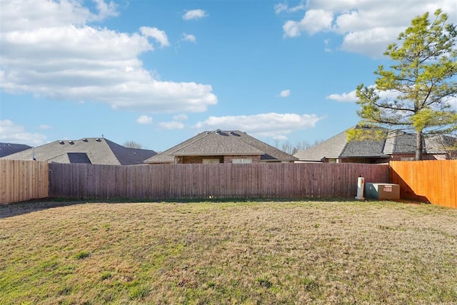 view of yard with a fenced backyard