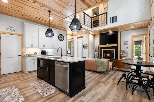 kitchen featuring wooden ceiling, white cabinets, dishwasher, and a sink