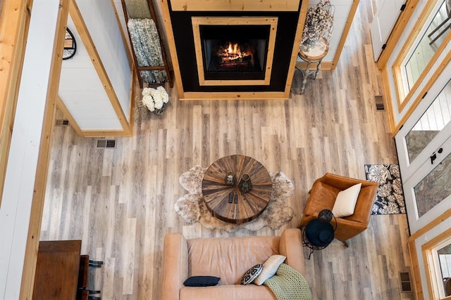 interior space with visible vents and wood finished floors