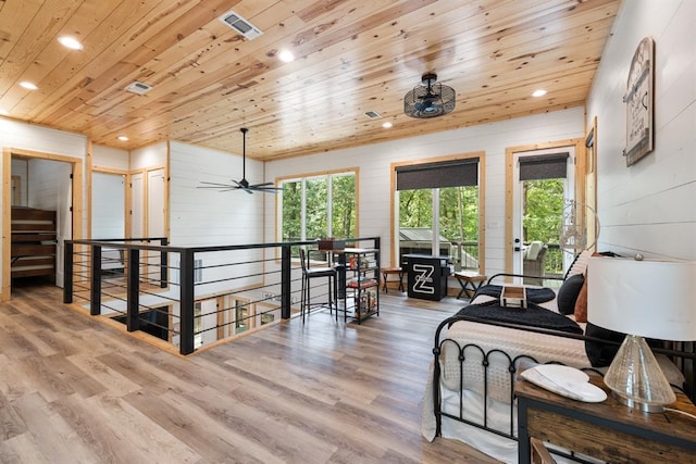 living area with wooden ceiling, wood finished floors, visible vents, and recessed lighting