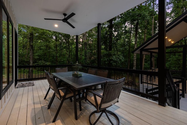 deck featuring a ceiling fan and outdoor dining space