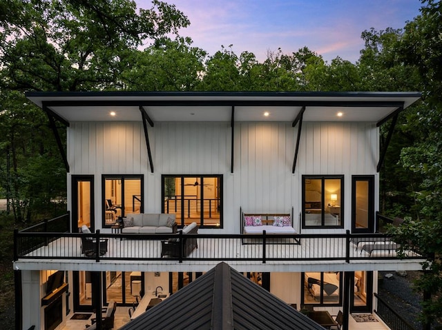 back of house featuring an outdoor hangout area