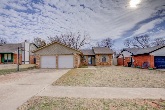 view of front of house with concrete driveway and an attached garage