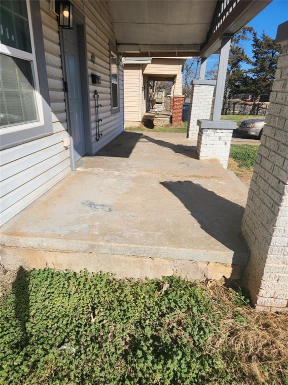 view of patio with concrete driveway