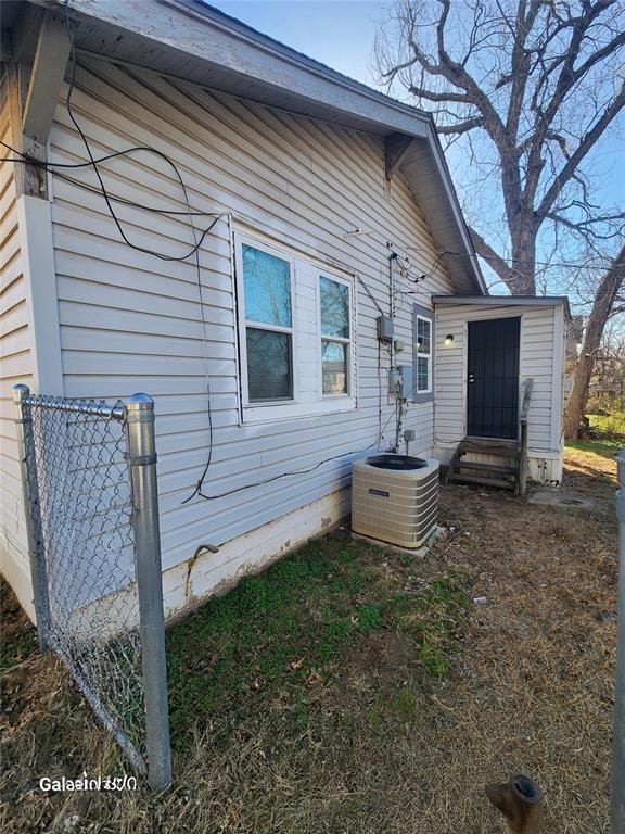 view of home's exterior featuring central air condition unit and entry steps