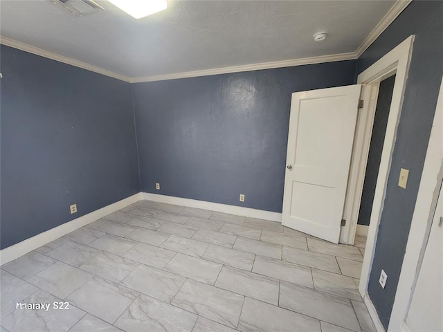 empty room with visible vents, marble finish floor, baseboards, and ornamental molding