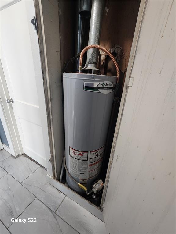 utility room with water heater