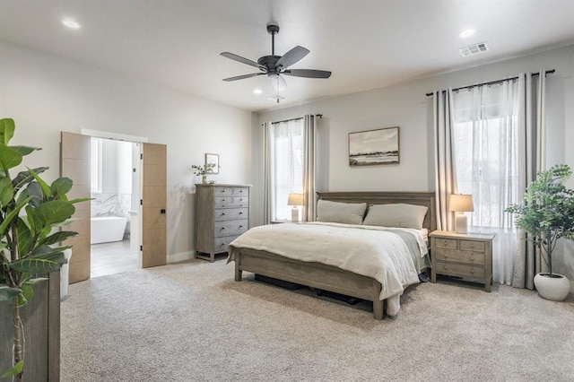 carpeted bedroom featuring a ceiling fan, recessed lighting, visible vents, and connected bathroom