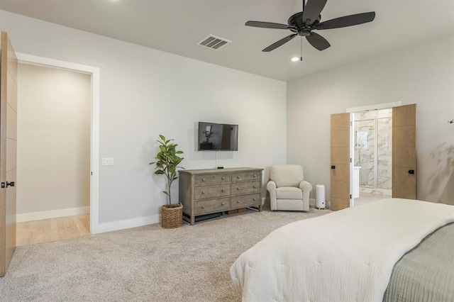 carpeted bedroom featuring baseboards, visible vents, recessed lighting, ceiling fan, and ensuite bathroom