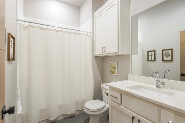 bathroom with toilet and vanity