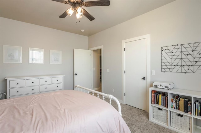 carpeted bedroom with a ceiling fan