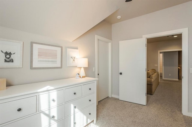 bedroom featuring light colored carpet