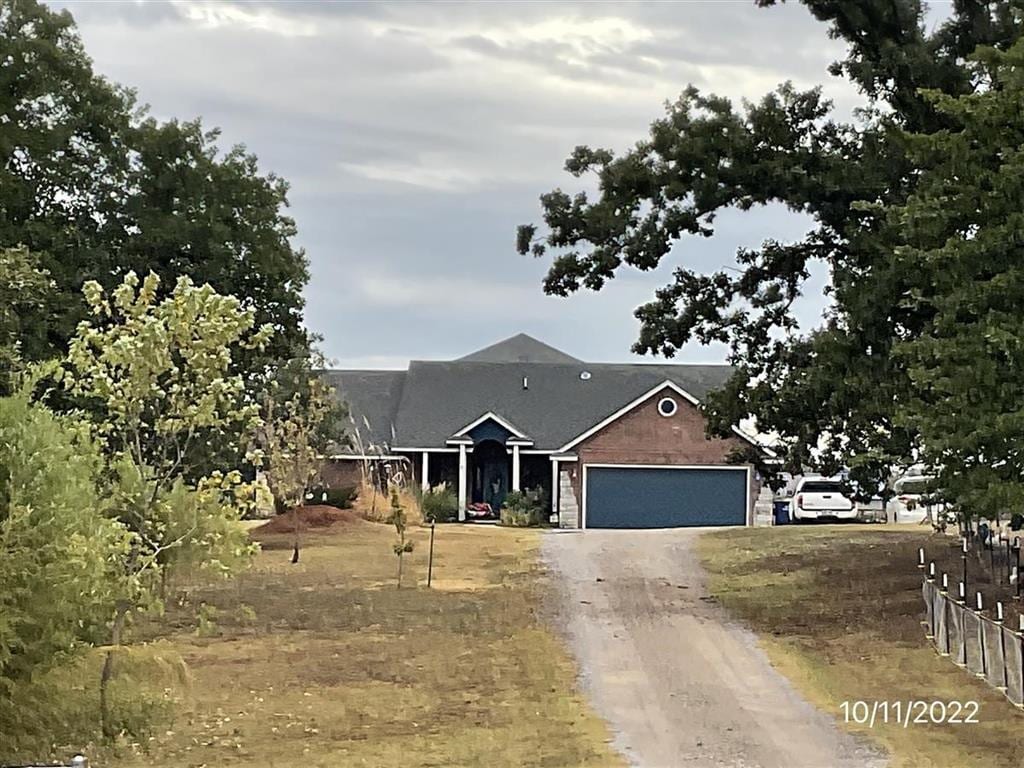 3308 S Indian Meridian Rd, Choctaw, OK 73020 - view of front of property featuring driveway and an attached garage