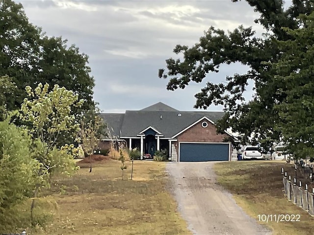 view of front of property featuring a garage and driveway