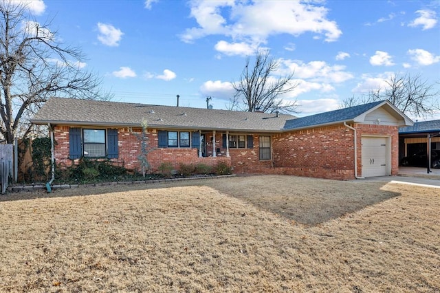 ranch-style house featuring brick siding and a garage