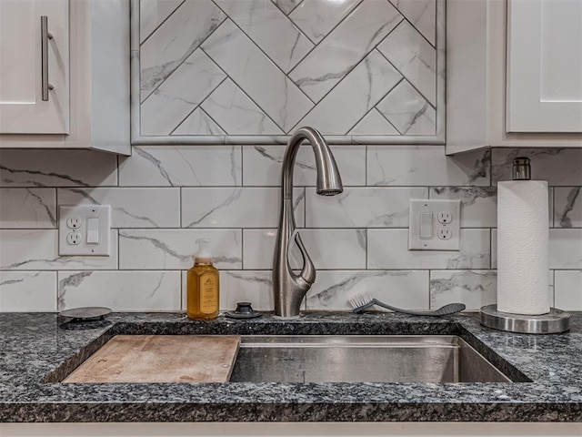 kitchen featuring decorative backsplash and white cabinetry