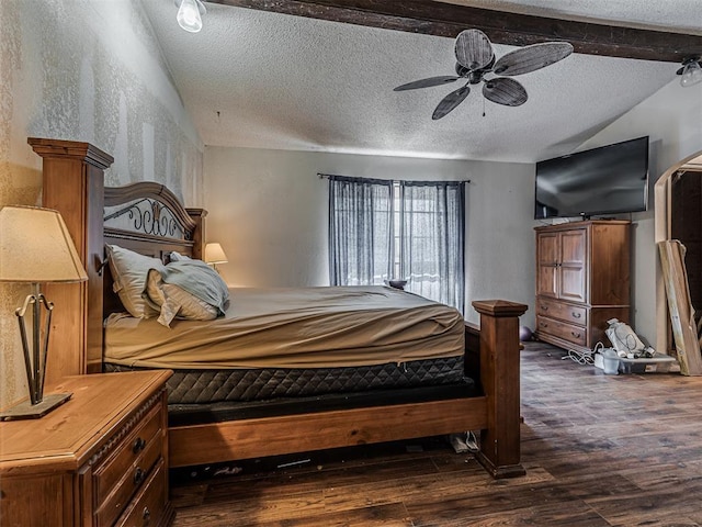 bedroom with lofted ceiling with beams, a ceiling fan, dark wood-style flooring, and a textured ceiling