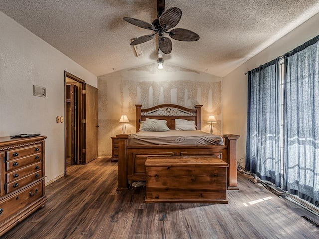 bedroom featuring a textured ceiling, wood finished floors, and vaulted ceiling