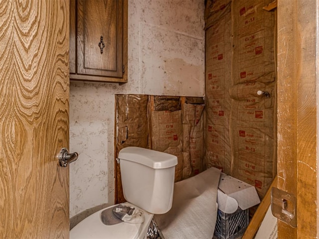 bathroom featuring wallpapered walls and toilet