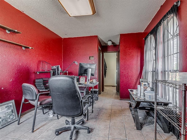 office featuring tile patterned floors, a textured ceiling, and a textured wall