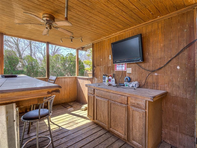 wooden deck featuring a jacuzzi and ceiling fan