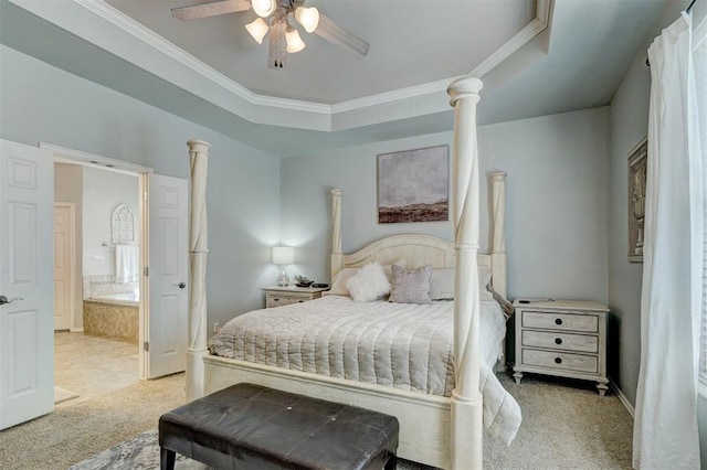 bedroom with decorative columns, a raised ceiling, carpet flooring, and crown molding