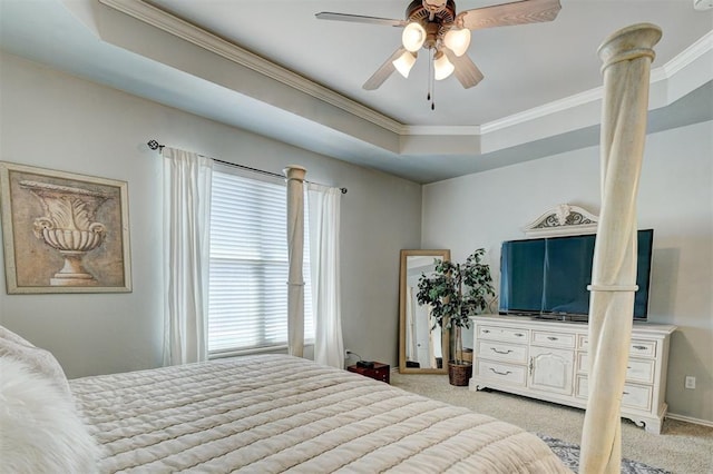 bedroom featuring ceiling fan, a raised ceiling, ornamental molding, and light carpet