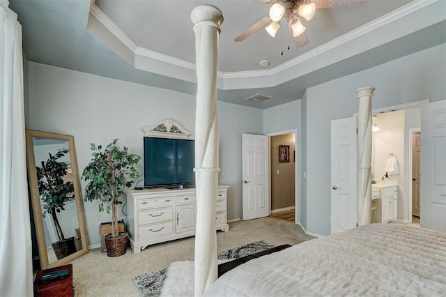 bedroom with carpet flooring, a raised ceiling, baseboards, and ornamental molding