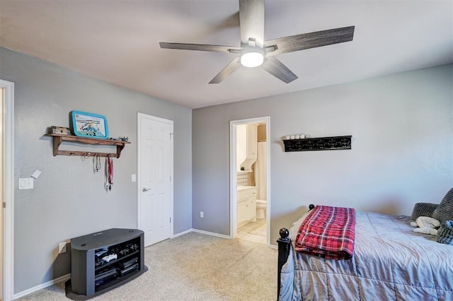 bedroom featuring ceiling fan, ensuite bathroom, baseboards, and carpet floors