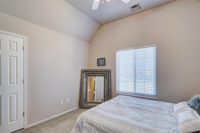 carpeted bedroom with visible vents, baseboards, ceiling fan, and vaulted ceiling