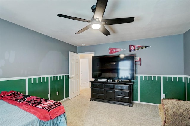 carpeted bedroom with a ceiling fan